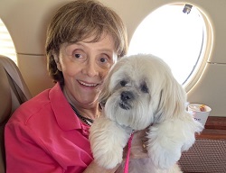 Vicki on her private jet charter with her pet parent